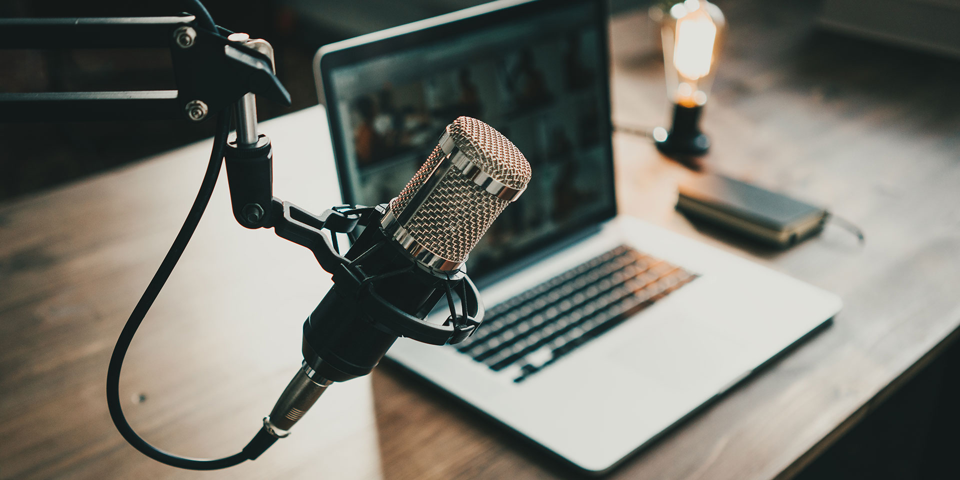 podcasting equipment on a wooden desk